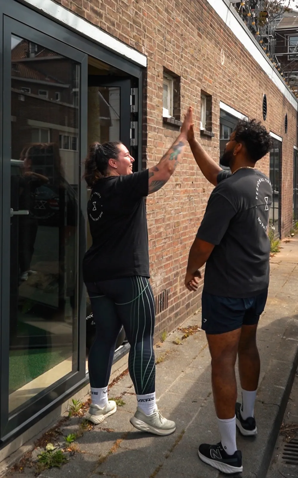 PFC clients celebrating with a high-five